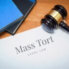 Mass Tort. Document with label. Desk with books and judges gavel in a lawyer's office. Depo-Provera and Intracranial Meningioma